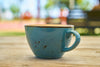 vintage green mug on table