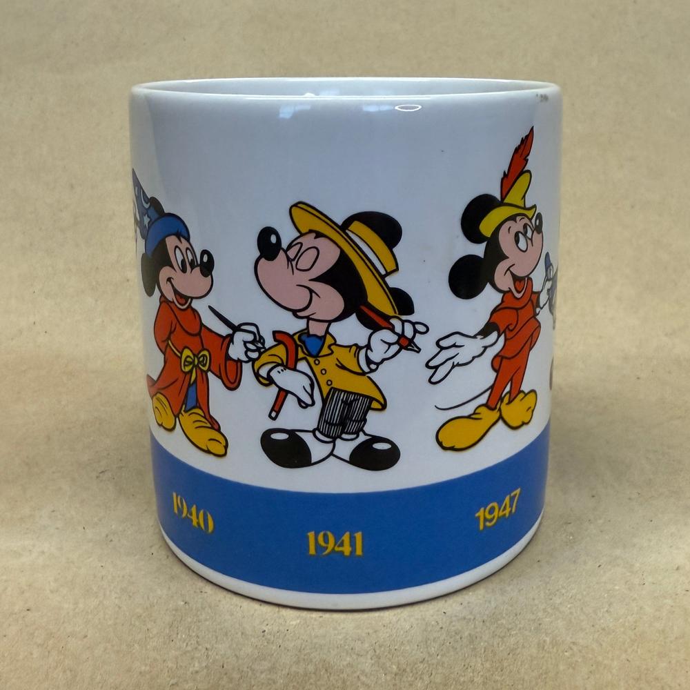 Disney Applause Mickey Draws Mickey Through the Years Mug-1990