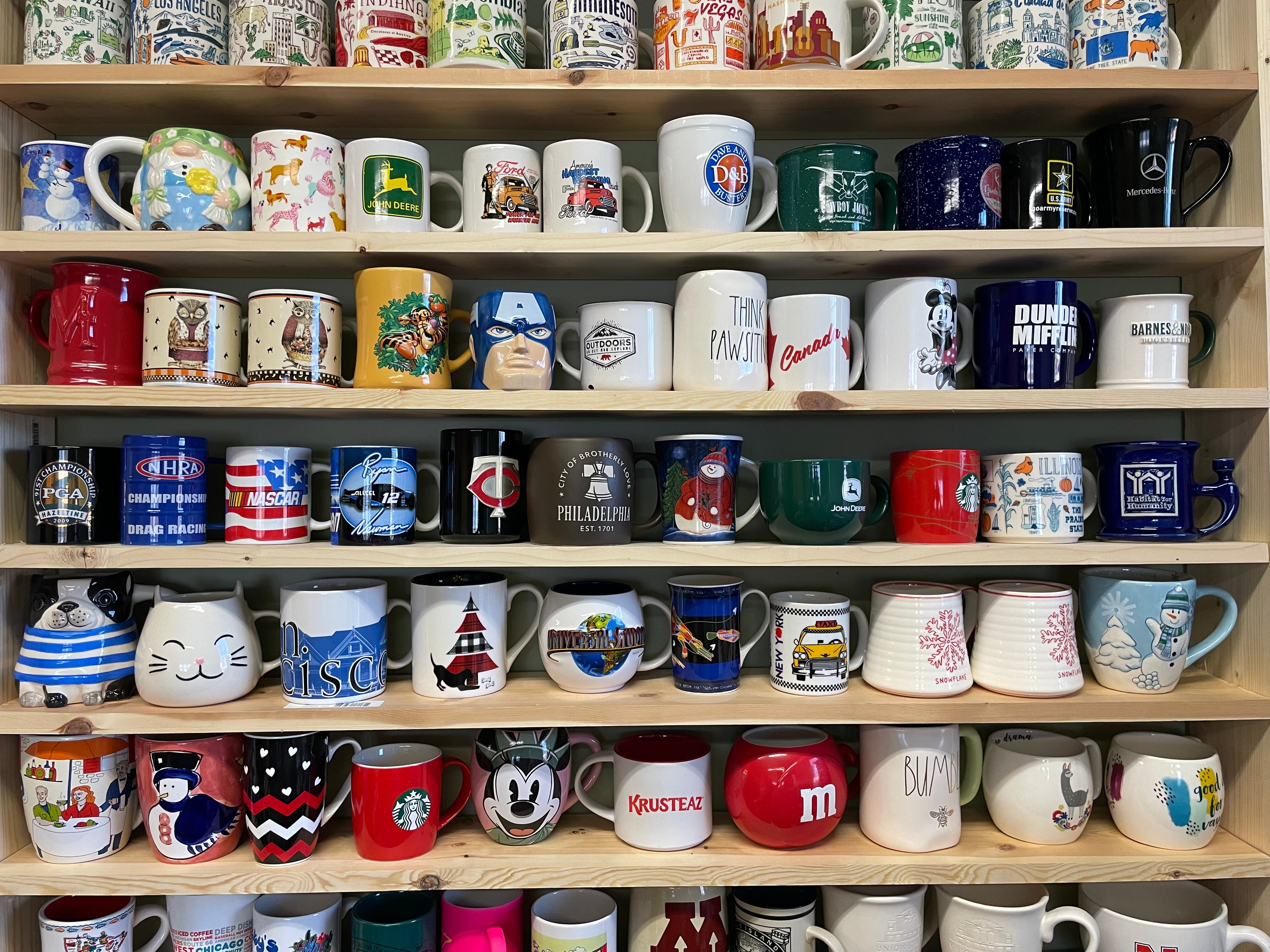 Shelf of various mugs